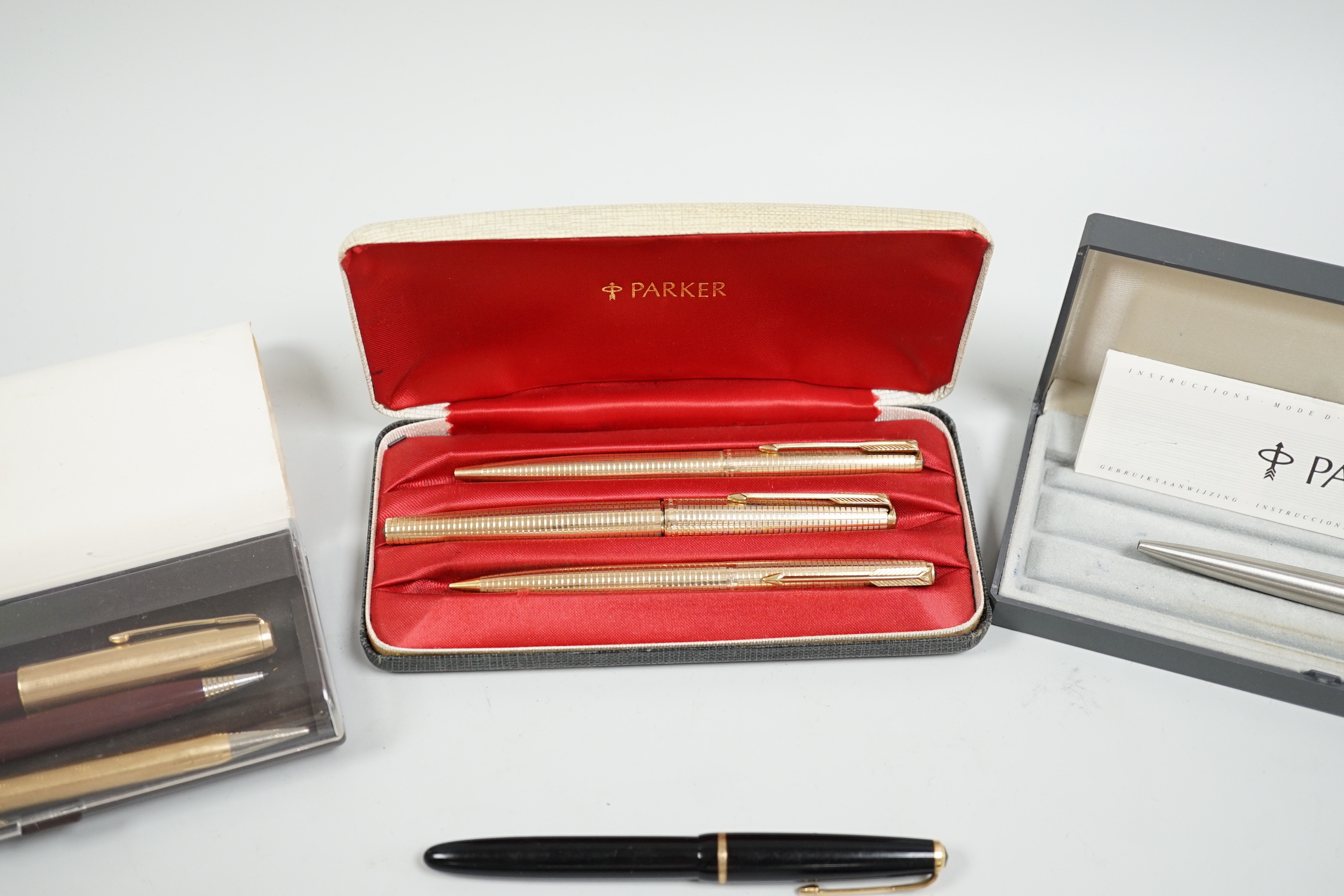 A Parker gold plated pen/pencil biro set and other Parker pens